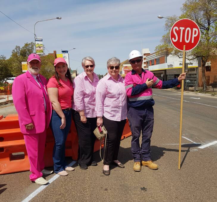 PINK UP PARKES: Mayor Ken Keith OAM, Marg Applebee, Jenny Breaden, Carolyn Rice and one of our traffic controllers getting into the spirit in 2019. Photo: Supplied.