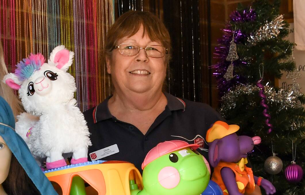 SUPPORT THE NEEDY THIS CHRISTMAS: Chris Symonds, Parkes Salvation Army Store Manager with some examples of toys that can be donated to the Christmas Appeal. Photo: Jenny Kingham.
