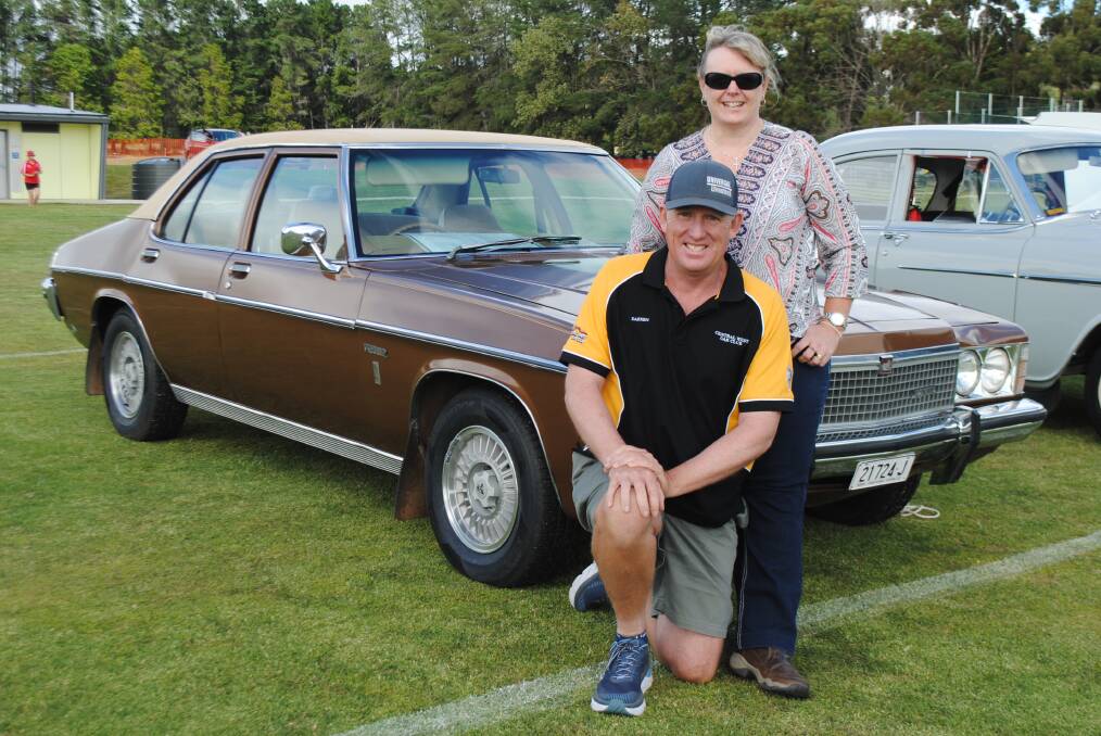 BROWN BEAUTY: Kylie and Darren Lydford from the Central West Car Club recently purchased an Holden HZ Premier. Photo: SUPPLIED.