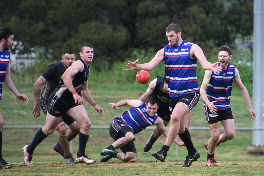 THRILLING VICTORY: The Parkes Panthers held off the Cowra Blues for an exciting three point win in muddy conditions at Northparkes Oval on Saturday. Photo: Jenny Kingham. 