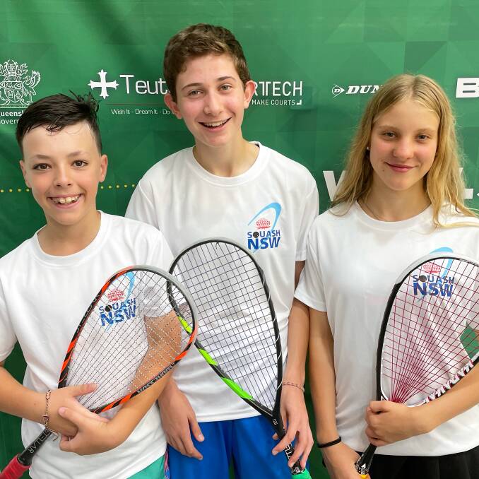WINNERS: Henry Kross, seen here with fellow national champions Maya Maziuk and Maggie Goodman from Squash NSW, took out the under 11's title. Photo: Supplied.