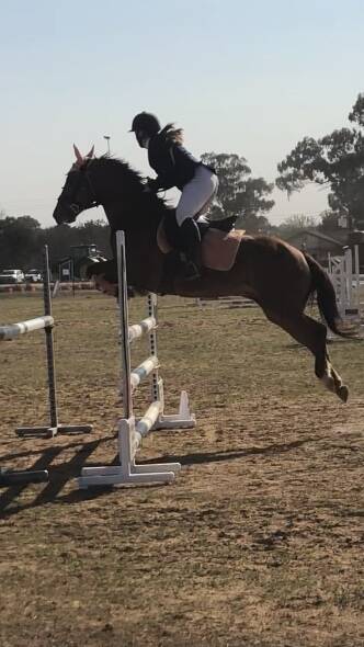 WHAT A PAIR: Jorja Rusten and Shadow, her trusty show jumping stead, will be heading to the Sydney Royal Easter Show next week. Photo: SUPPLIED.