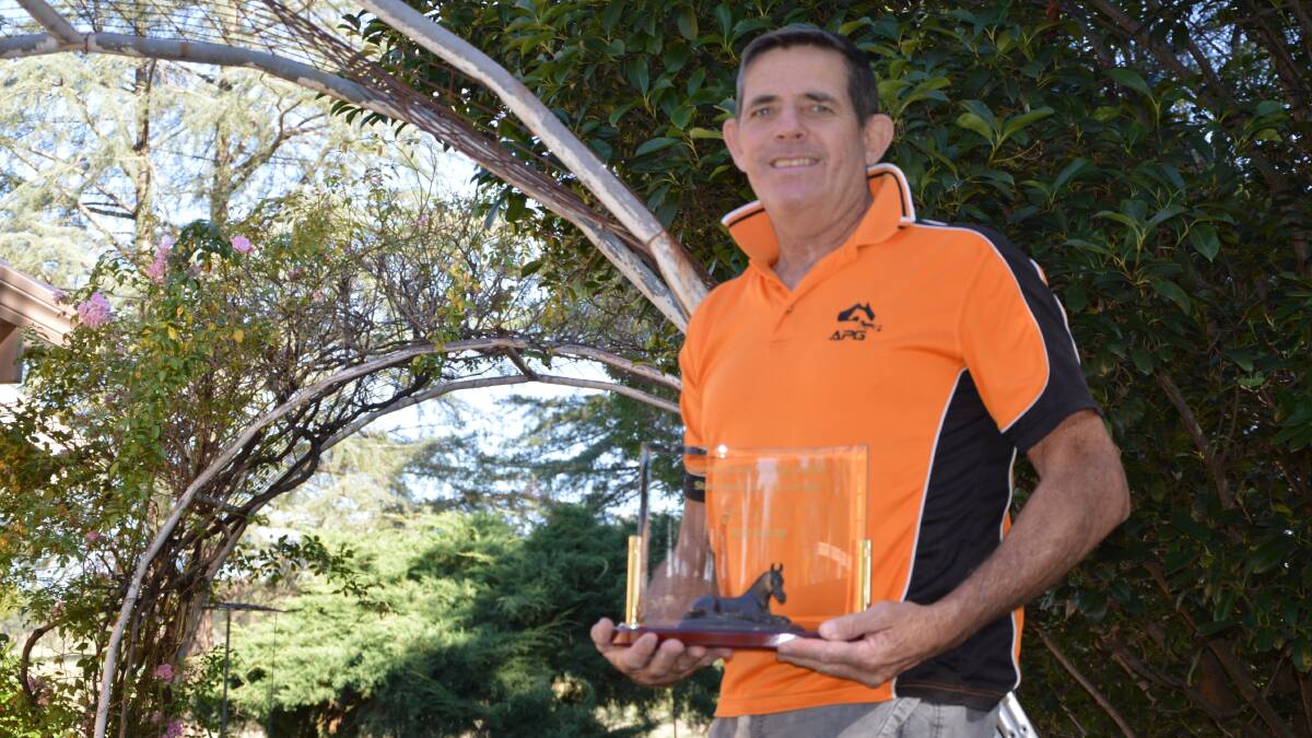 BIG ACHIEVEMENT: Tony Dumesny with the 2021 NSW Outstanding Contribution to Breeding Award, which was given to him and his parents Stan and Nancy. Photo: Kristy Williams.