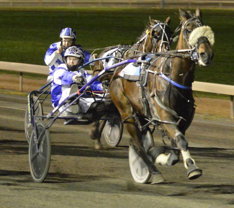 BIG EFFORT: Parkes trainer-driver William Cassell won with Gotta Kick at the Parkes Harness Racing Club last Friday night. It was the gelding's second win in his last three starts at Parkes. Photo: KRISTY WILLIAMS.