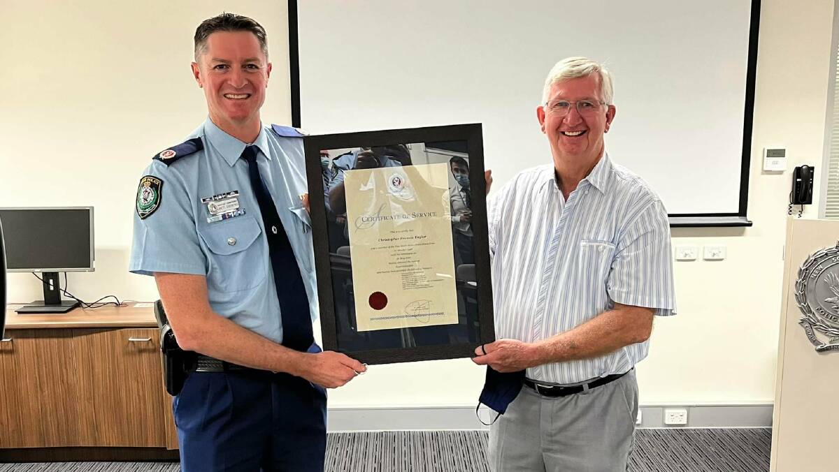 WHAT AN EFFORT: Western Region Commander Assistant Commissioner Brett Greentree presents Superintendent Chris Taylor with his 'Certificate of Service', commending over 50 years of service to the NSW Police Force. Photo: CENTRAL WEST POLICE DISTRICT FACEBOOK.