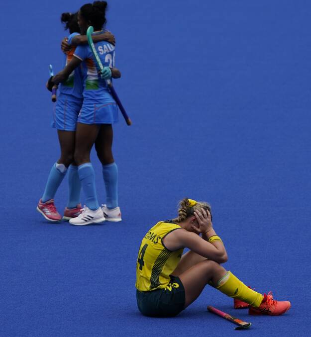 DEVASTATING LOSS: Hockeyroo Mariah Williams sits dejected on the Oi Hockey Stadium turf after Australia lost to India 1-nil in the quarter-finals of Tokyo Olympics. Photo: JOHN LOCHER, AAP.