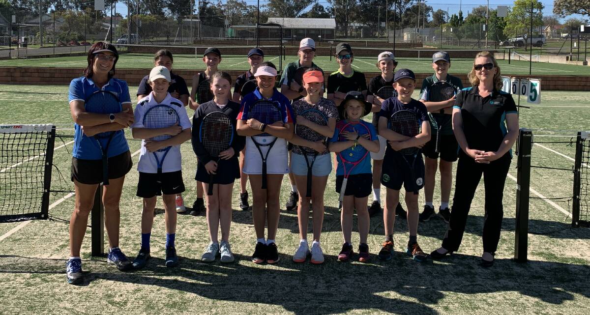 INCREDIBLE INITIATIVE: Parkes Tennis juniors with Coach Helen Magill and Wright Mortgage Solutions Finance Mortgage Broker Jade Wright. Be sure to mention Parkes tennis when you get a home loan. Photo: SUPPLIED.