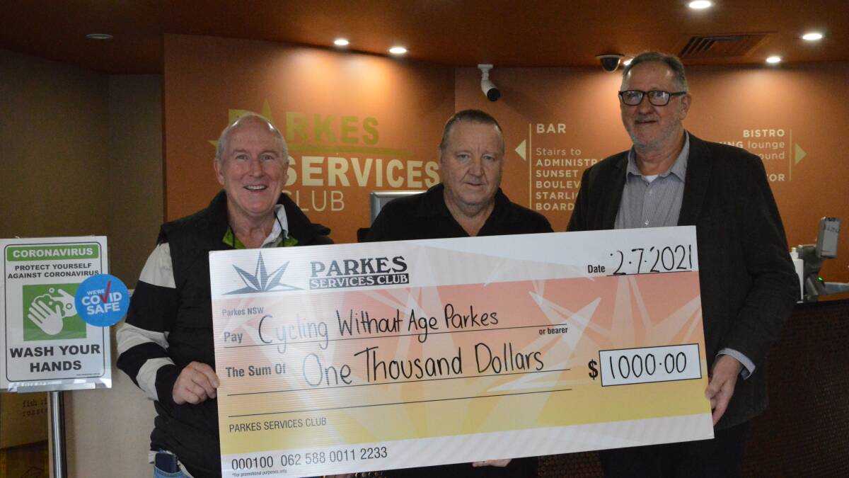 GOOD NEWS: Warren Edwards (left) and chairman Peter O'Donnell with Parkes Services Club general manager Mike Phillips (centre).