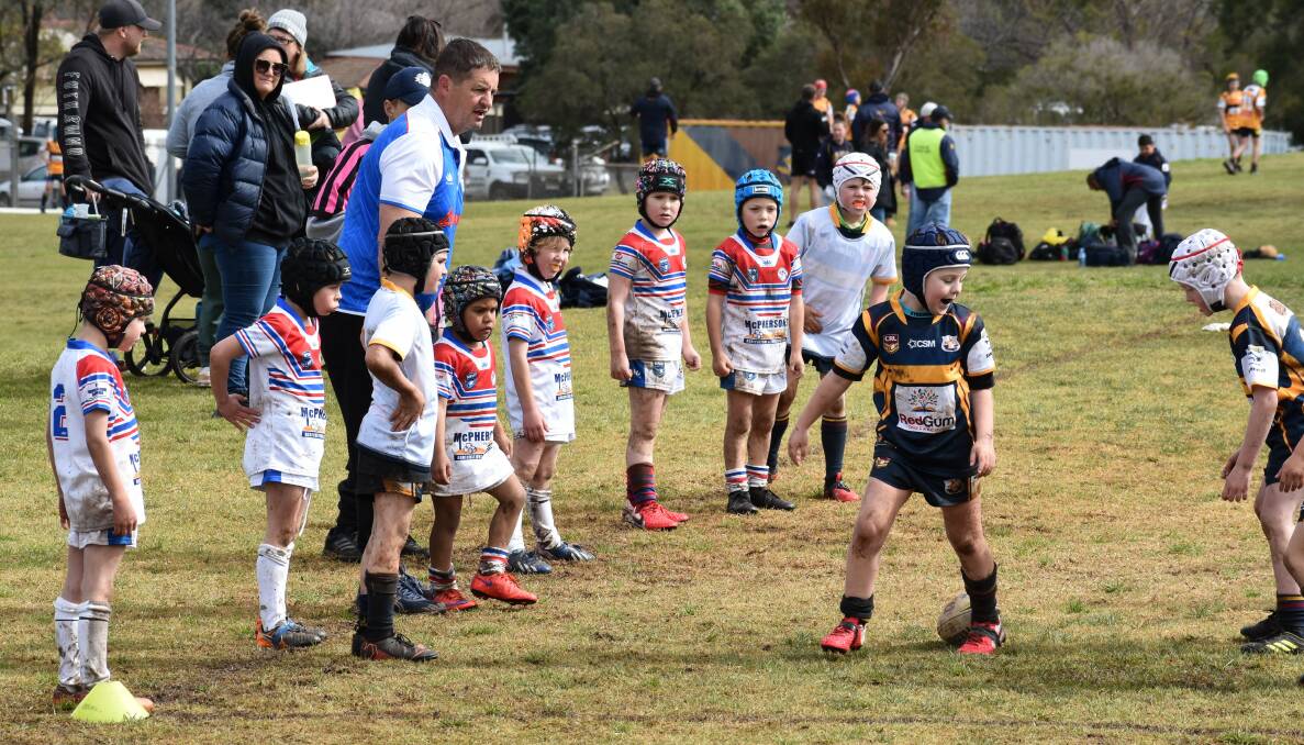 MUDDY WARRIORS: McPherson Parts and Services Under 7s line up in the wet. Photo: Supplied.