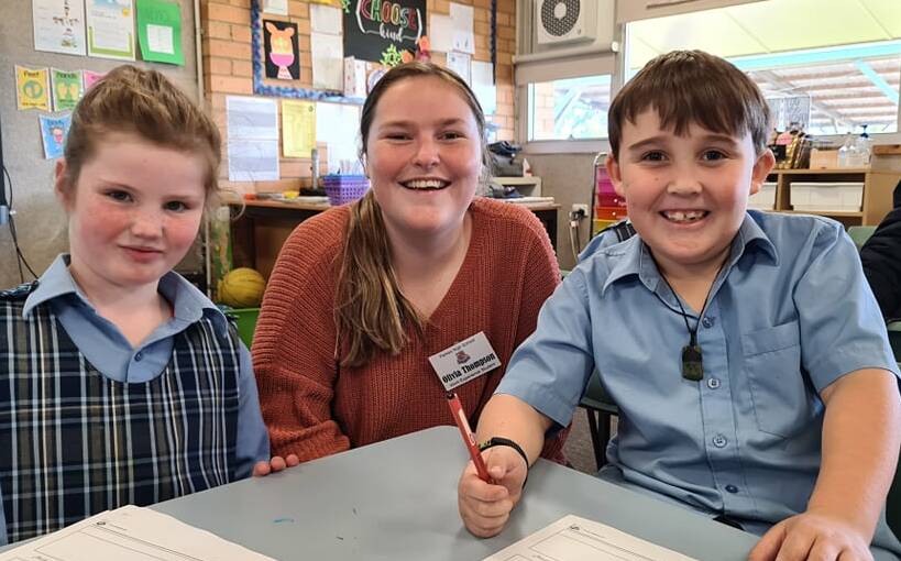 Olivia Thompson at Parkes Public school helping some students.