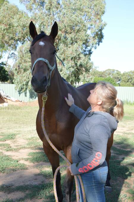 Sharon Jeffries, pictured here at her Parkes stables with gelding Coulpa, came home from Warren a winner.