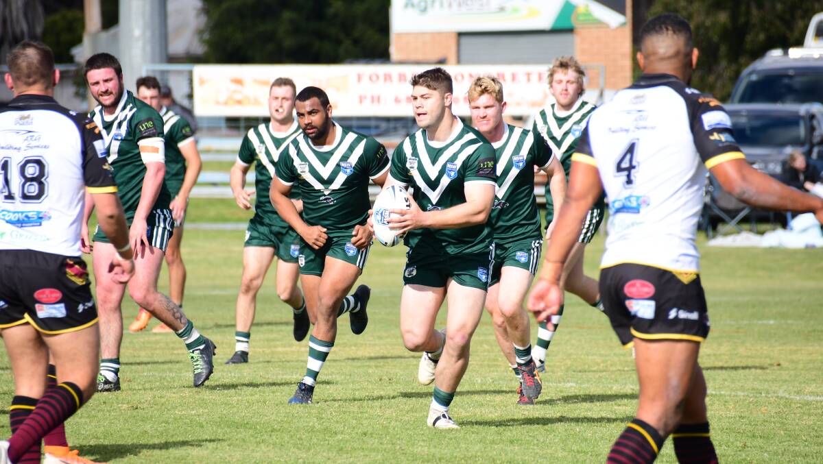 CHARGING AHEAD: Parkes' Jordan Pope carries the ball for the Western Rams against the Hills Bulls. Photo: Amy McIntyre.