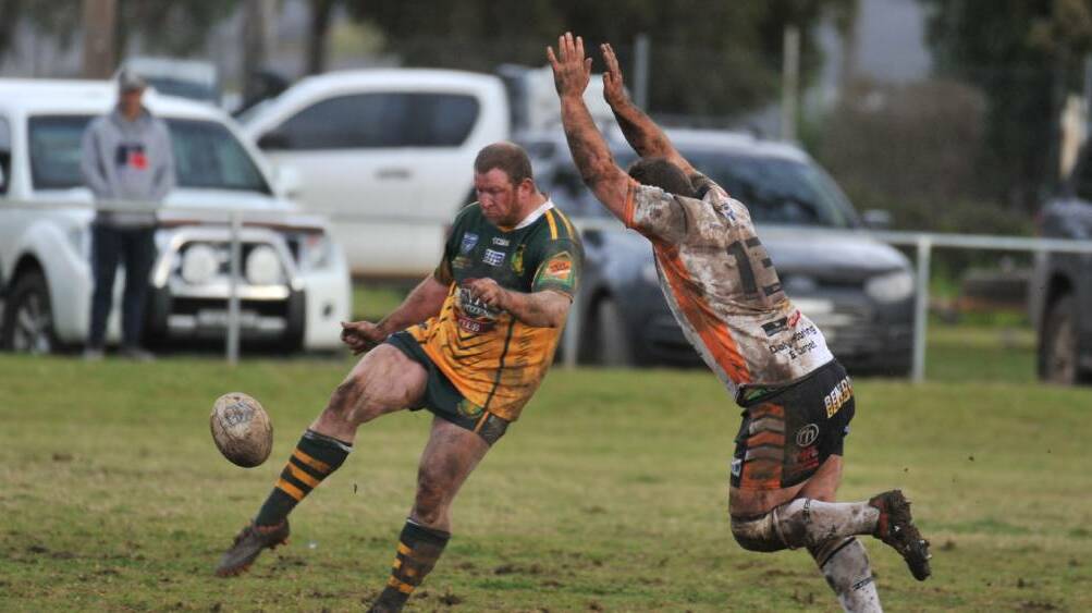 Adam Hall puts a kick for the Trundle Boomers.