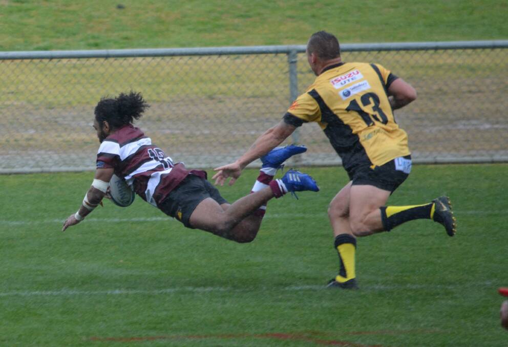 TRY TIME: Nathan Llangalli scores for the Boars second grade side. Photo: Allan Ryan.