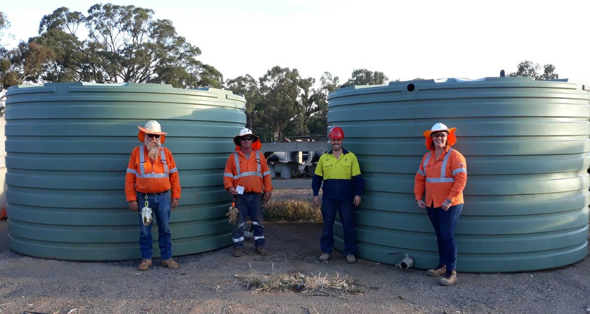 DELIVERY: Darren and Ian from Blayney Crane Services, who delivered the tanks to Council's Works Depot, with Parkes Shire Council's Procurement Officer Michael Walker and INLink Community Relations Manager Angela Corbett. Photo: Submitted