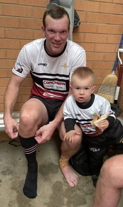 GENERATION NEXT: Boars forward Dan Ryan with his son Wally - a sausage sandwich and rugby union enthusiast. Photo: Allan Ryan.
