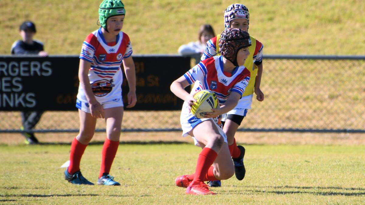BUDDING SUPERSTAR: Jamison Lee puts on a Benji Marshall sidestep for the under 10s earlier this year against Condobolin. Photo: JENNY KINGHAM.