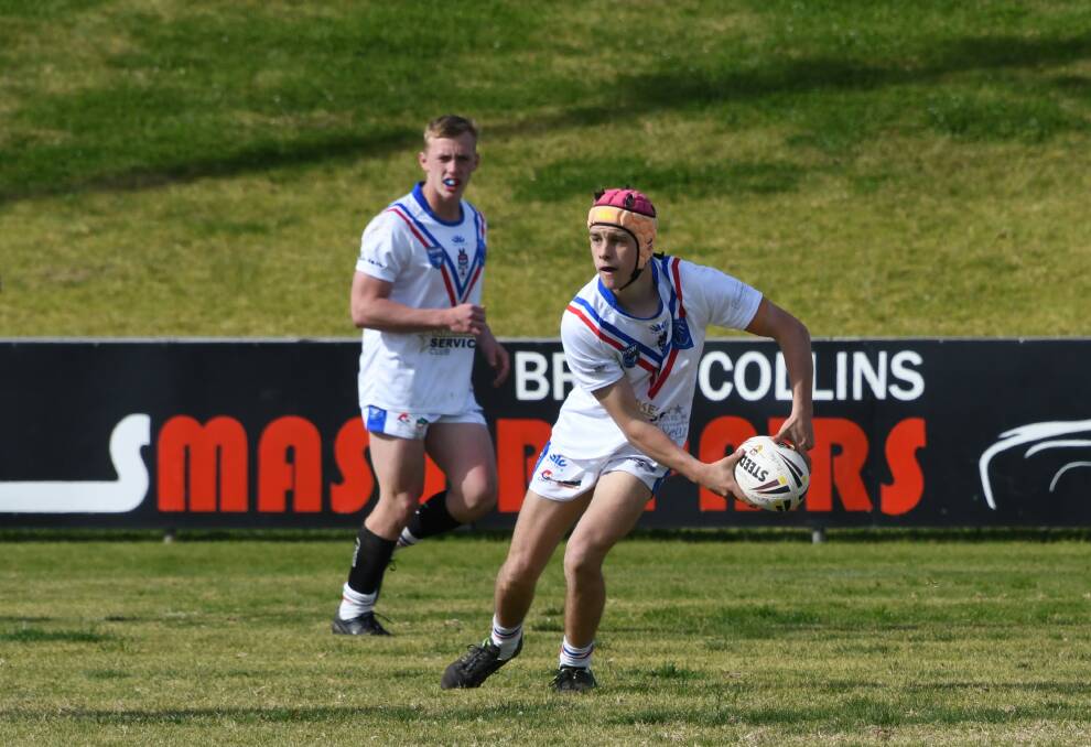 YOUNG GUNS: Toby Miller (left) and Billy Simpson (with the ball) were key players for the Spacemen, with Toby receiving the three Best and Fairest votes. Photo: Jenny Kingham.