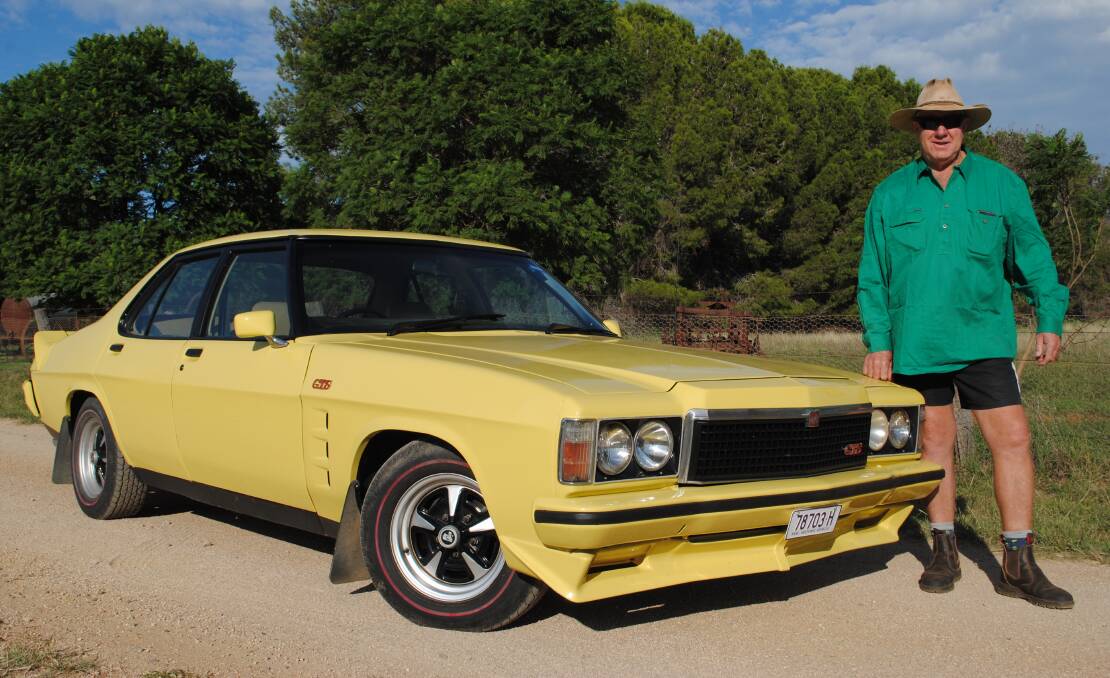 WHAT A BEAUTY: Andrew Townsend with his jasmine yellow 1977 Holden HZ GTS sedan, one of only 1438 ever made. Photo: Supplied.