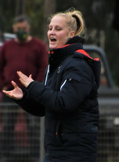 LEADING THE WAY: Meaghan Kempson coaching the Parkes Cobras from the sideline earlier this month. Photo: JENNY KINGHAM.