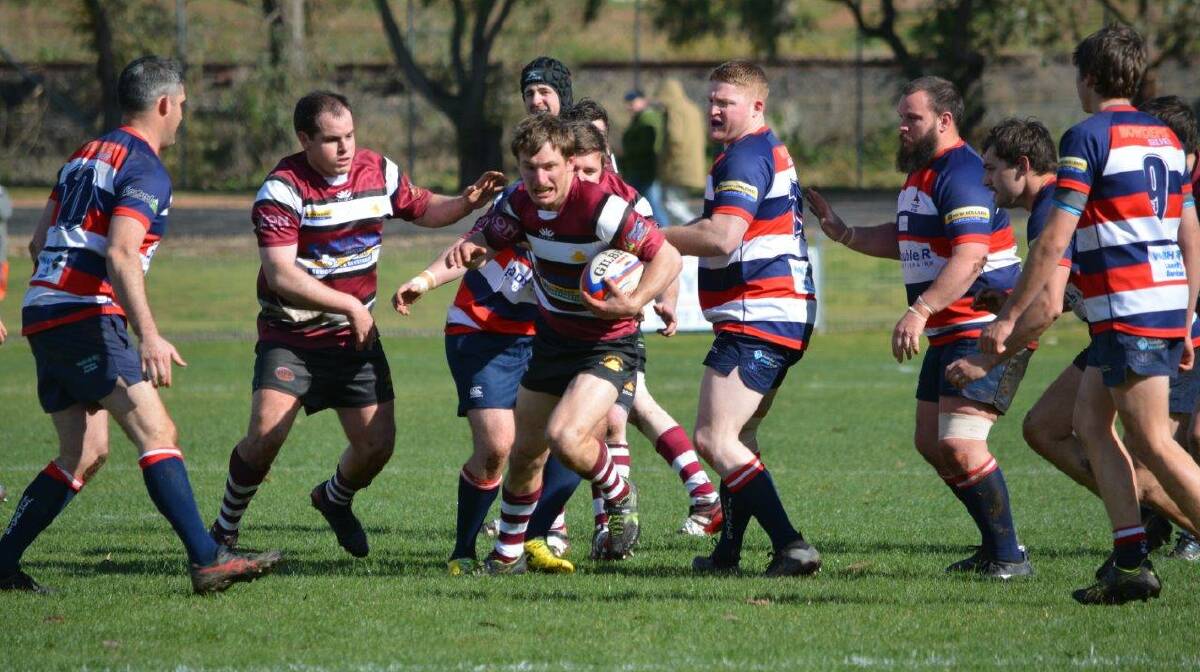 ON THE CHARGE: Mitch Westcott gets away from the Mudgee defence. Photo: Allan Ryan.