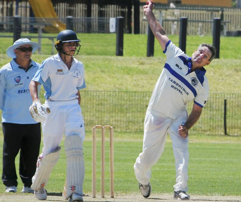KEEPING IT TIGHT: Clinton Hawke (bowling) was crucial for the Cambridge Cats in their semi final win over Cowra Bowling Club on Saturday afternoon, conceding just seven runs from seven overs. Photo: Jenny Kingham.
