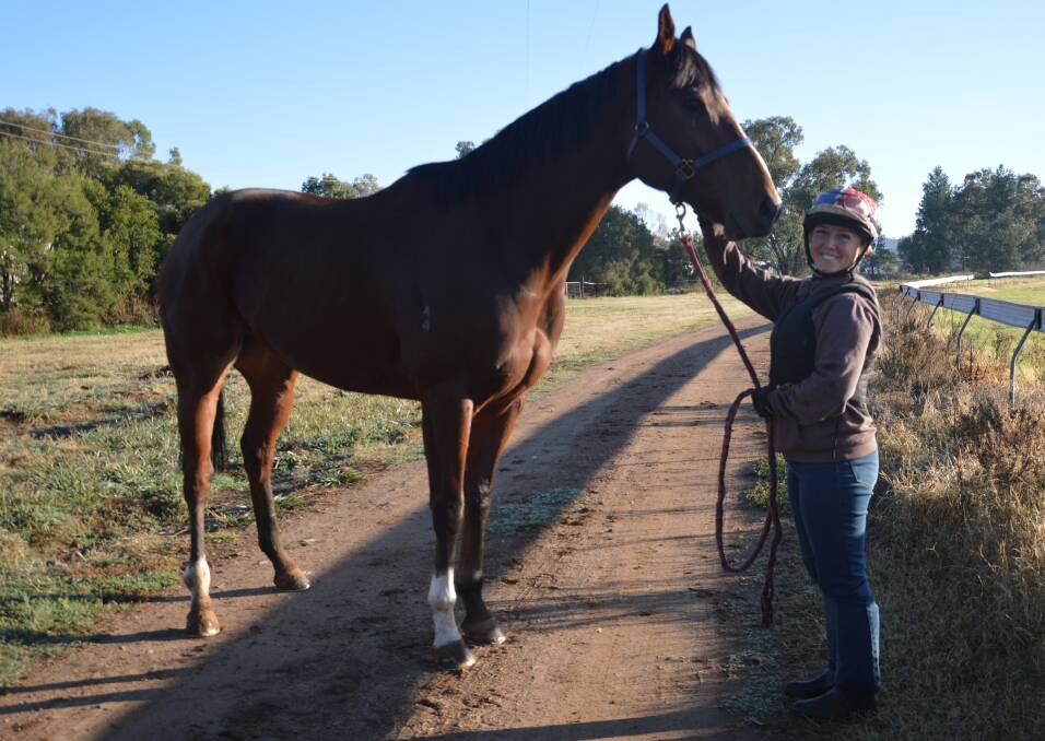 RACING AT HOME: Parkes jockey Tiffany Jeffries with Thee Jenner, which is owned by her husband Alex Prout and trained by her mum Sharon. The gelding will be running in Race 5 on Sunday. Photo: Kristy Williams.