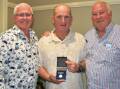 WHAT AN HONOUR: Tony Dwyer (left) and Warwick Wheeldon (right) present Paul Clyburn (centre) with his badge. Photo: JENNY KINGHAM.