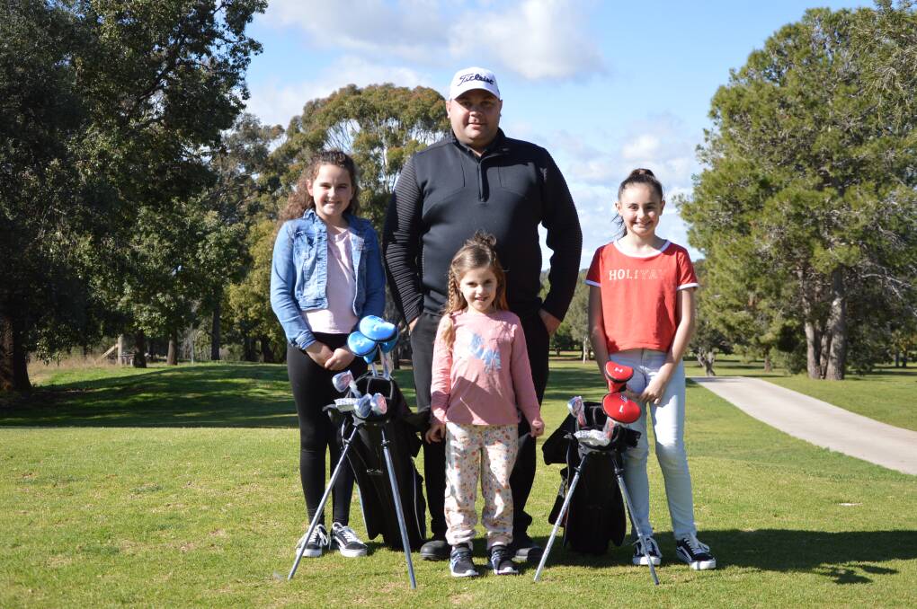 NEW PRO: Jake O'Brien and his family (from right to left): Poppy Riley, Pippa Robb and Lexie Robb at Parkes Golf Club. Photo: Kristy Williams.