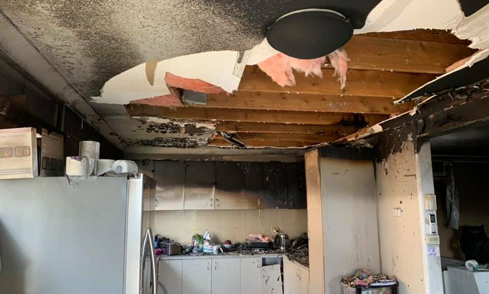 BLACKENED: There was extensive damage in the kitchen area of the house. Photo: Fire and Rescue NSW Station 417 Parkes.