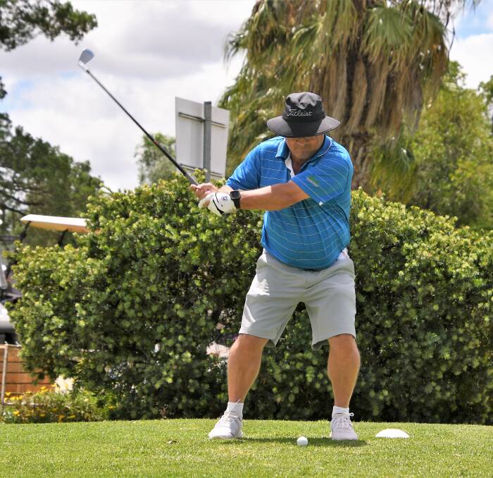 IN FORM: Mark Kelly tees off at the Parkes Golf Club. Photo: JENNY KINGHAM.
