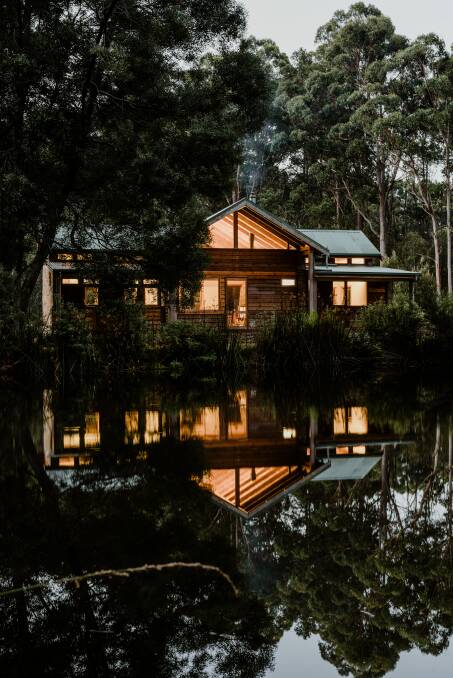 RURAL ROMANCE: The building glows like a lantern over the lake at night. Photo: Adam Gibson