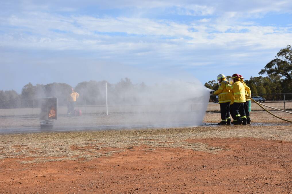 Battling the blaze: The Rural Fire Service put on a great demonstration for the crowd and displayed their fire fighting skills. Photo: File.