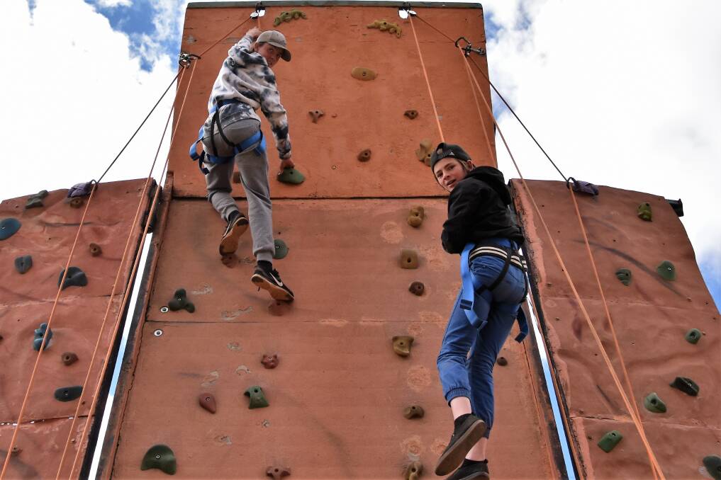 Sky is the limit: Taigan Brennan-Ingram and Chris Moore made it to the top of the North West Climbing Rock Wall. Photo: Jenny Kingham.