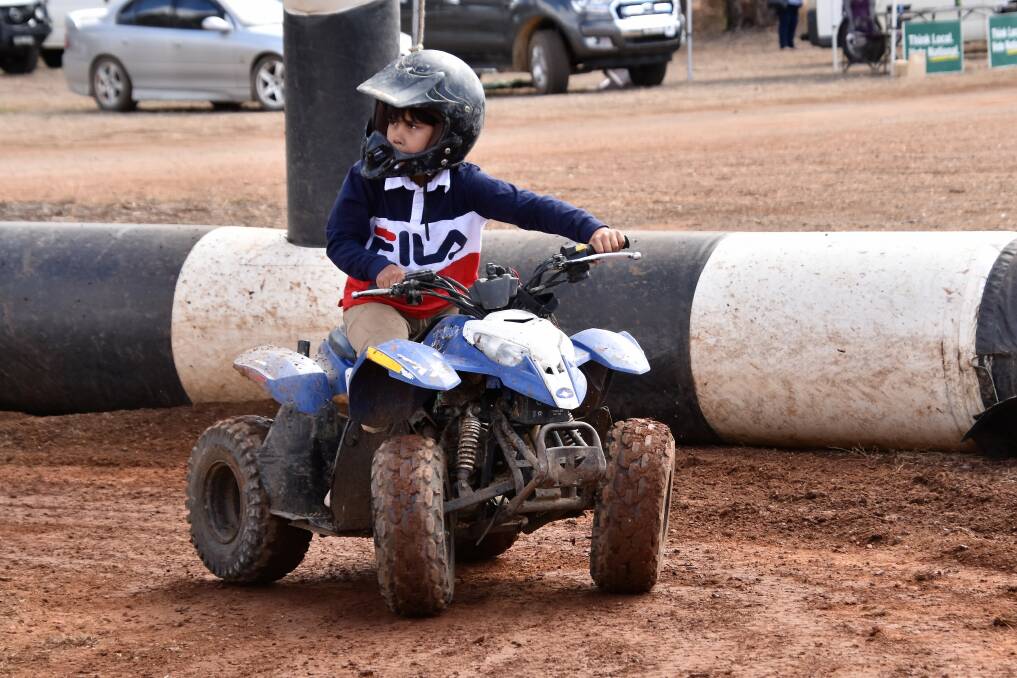 Fun on all fours: Mundara Read had a great time riding the mini four wheeler at last year's Peak Hill Show. Photo: Jenny Kingham.