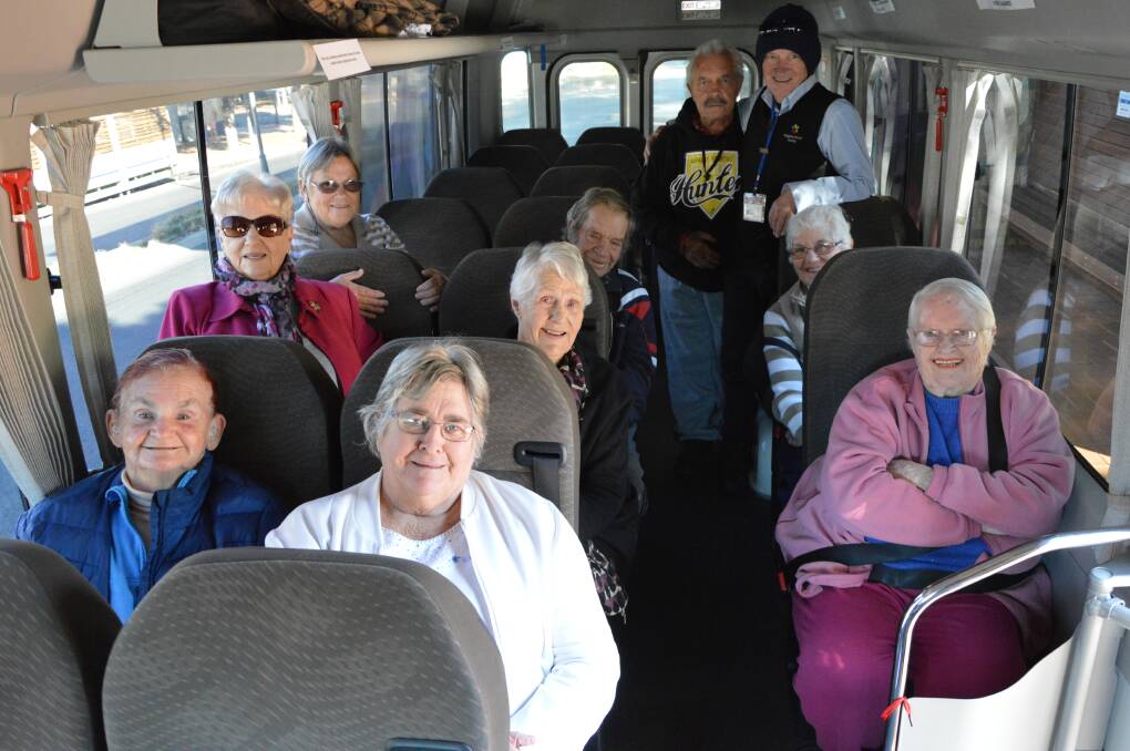 Help where it's needed: Neighbourhood Central Volunteer Bus Driver, Ray Brown, gets the team ready to leave on another day out. Photo: Supplied.