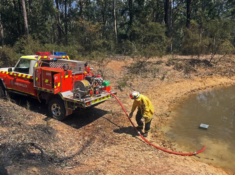 Water is drawn from a dam to replenish the Martinsville brigade's light tanker. Picture: Joerg Hofmann, Martinsville Rural Fire Brigade