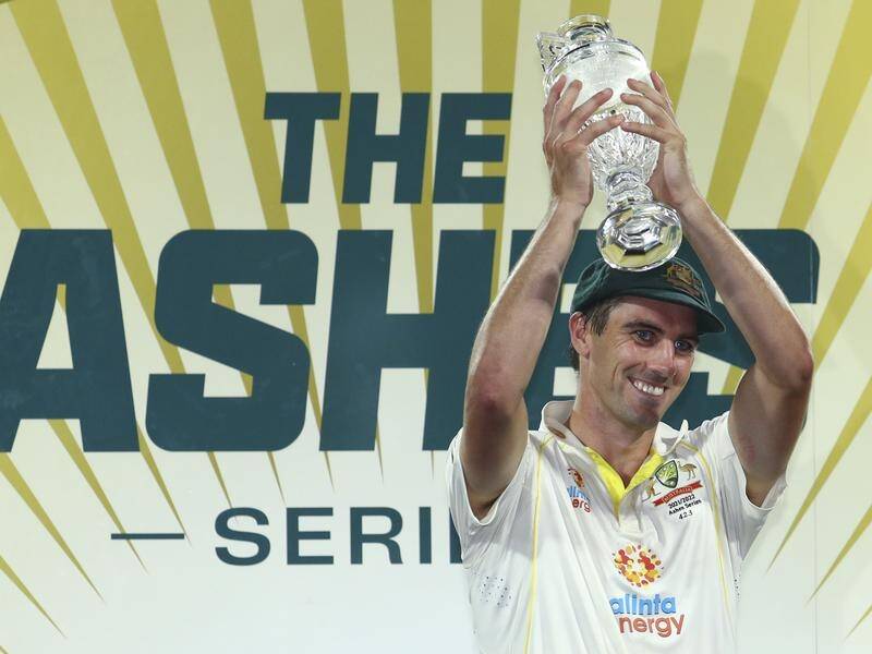 Australia captain Pat Cummins holds the Ashes trophy which he did so much himself to help win.