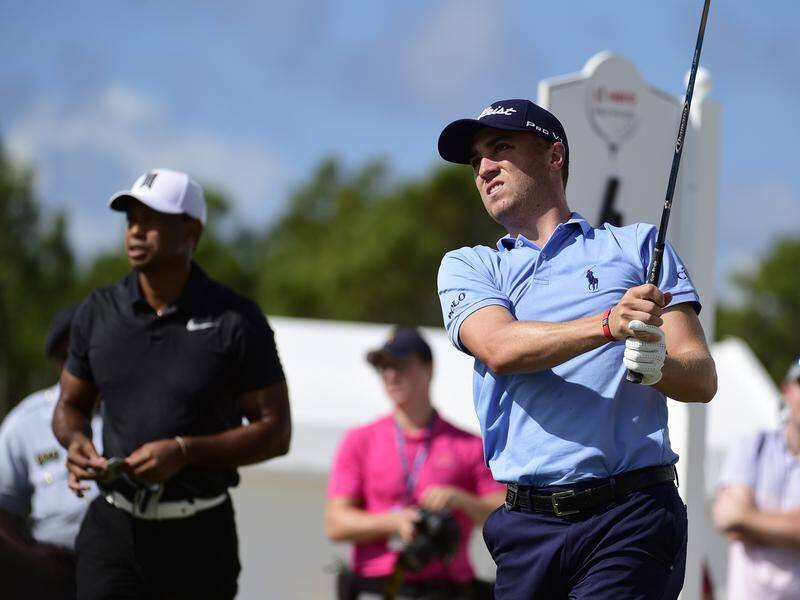 Justin Thomas (r) expects Tiger Woods to select himself to play for the US at the Presidents Cup.