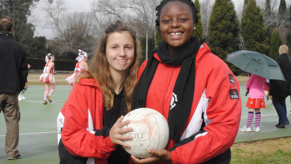 Flash Back: Highlands netballers and friends Lily Mauger and Adiel Mkolo at the Eridge Park netball courts on Saturday. Photo by Josh Bartlett