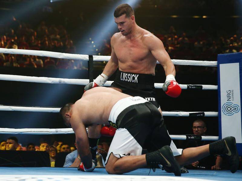 Darcy Lussick has won a battle of the rugby league stars in his boxing bout against Justin Hodges.