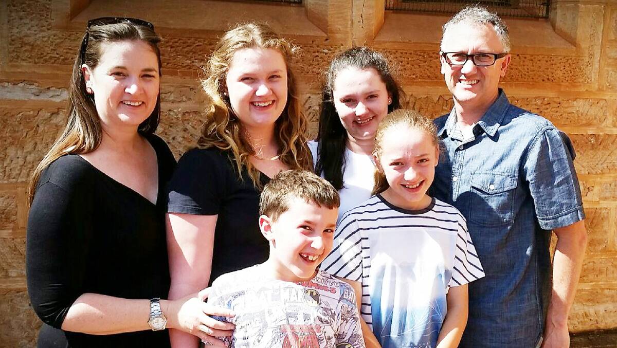 The Watterson family, Reverend Michelle (deacon), Elizabeth (Lizzie) age 14, Amy (15), Reverend Canon Brett (priest); front: Samuel (Sam, 8) and Lillian (Lil, 10).
