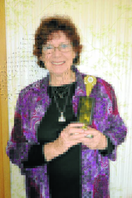 Kath Swansbra with her latest national award.