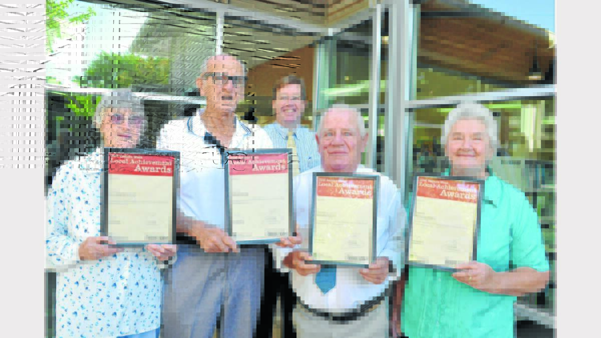 Local State MP, Troy Grant (centre) presented Certificate of Achievement to local seniors, Yvonne and Jim Hutton (left) and Tom Snow and Marg Thurn at a ceremony at the Parkes Library on Friday.           Photo: Roel ten Cate  