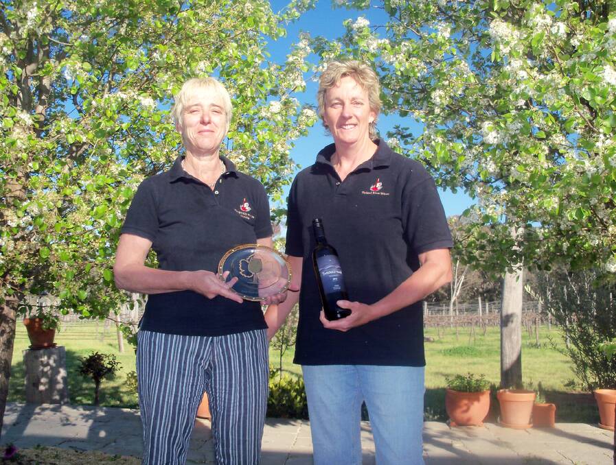 A 2013 shiraz viognier produced by local boutique winery Twisted River Wines has been named champion wine of the show at the National Cool Climate Wine Show.
Michelle Davies and Helen Armstrong are pictured with an earlier award.