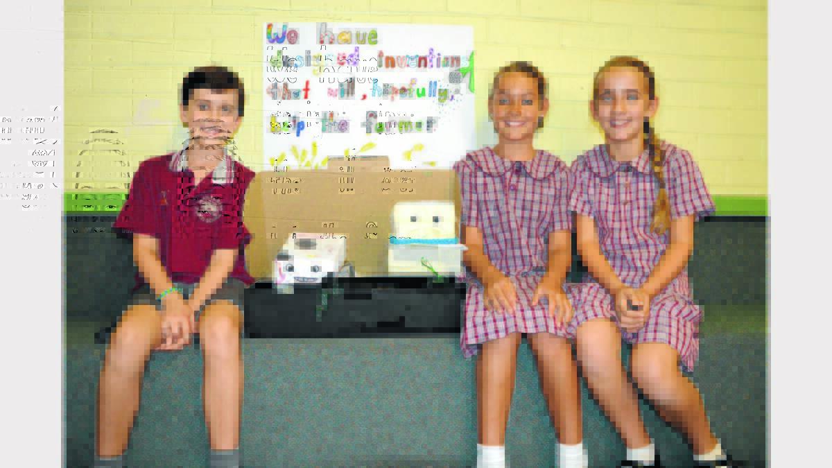 Calvin Matthews, Ruby Dawson, Isabella McRae with the animal robots they invented to help farmers.