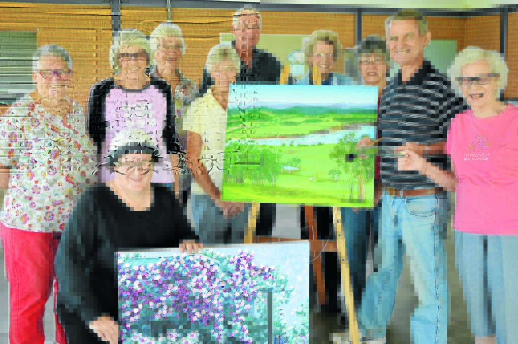 Preparing for the Parkes Painting Group exhibition - left to right, Elsie Mahon, Bronwyn Riley (front), Robyn Morrissey, Heather Moss, Margaret Lewis, Michael Henry, Margaret Wright, Joan Ash, Kim Chambers and Dee Melville.   Photo: Bill Jayet    
   