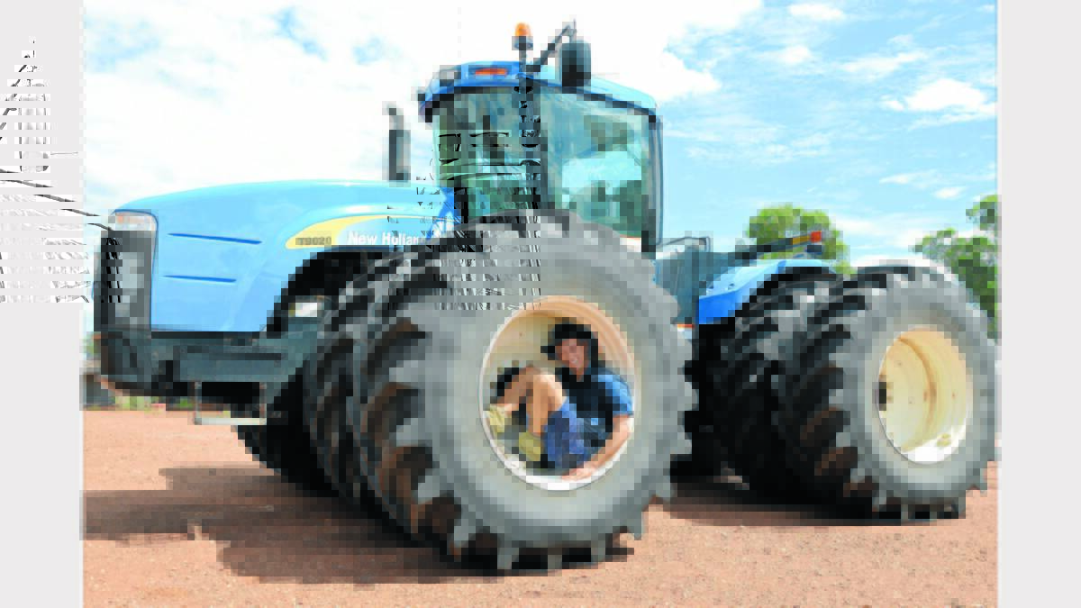 Today’s modern tractors make life a lot easier for today’s modern farmer. Hayden Westcott emphasised the size of the tractor with this fun shot.   Photo: Bill Jayet.   