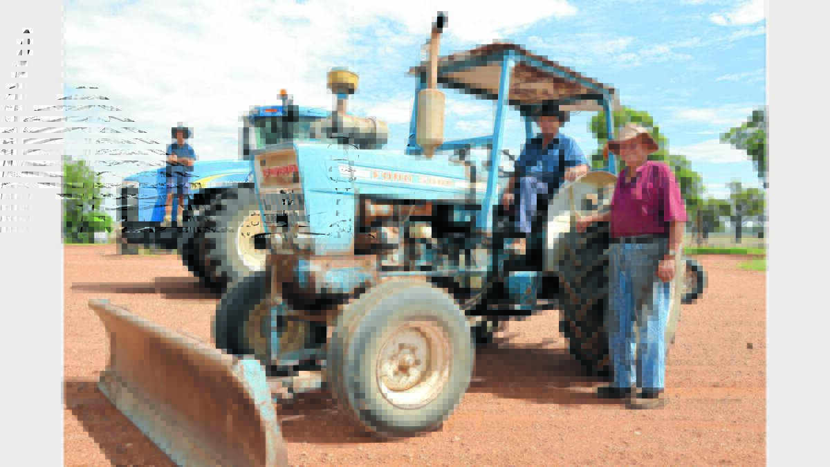 Neil and his dad Cliff with one of the property’s original tractors a Ford 5000. Photo: Bill Jayet.