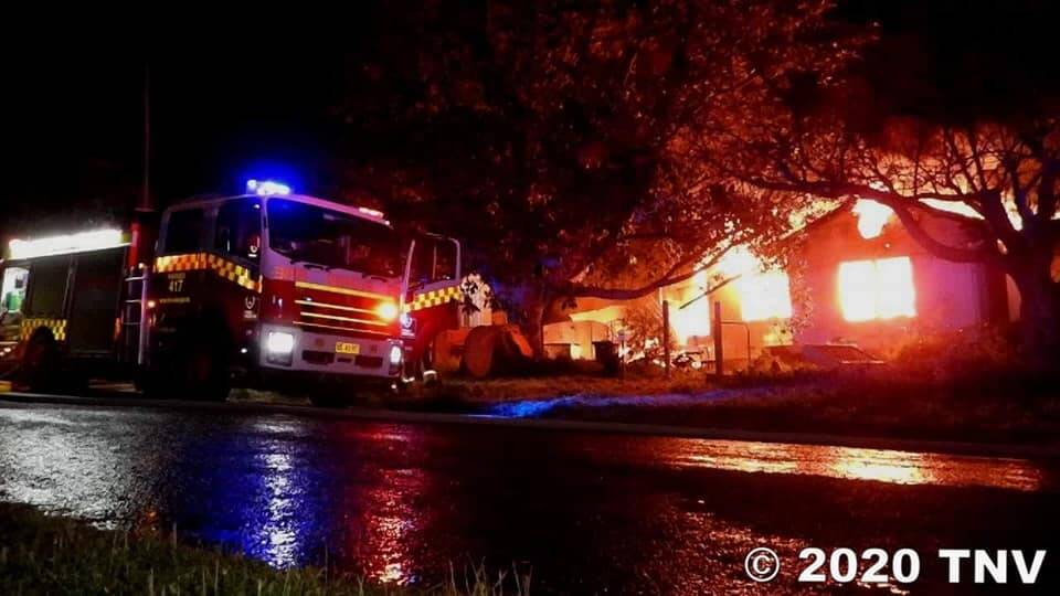BLAZE: A home in Parkes was engulfed in flames during an overnight blaze on Thursday evening. Photo: TOP NOTCH VIDEO, FRNSW